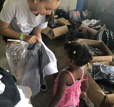 Students Handing Out Donated Items