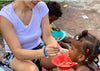 Volunteers Feeding Children